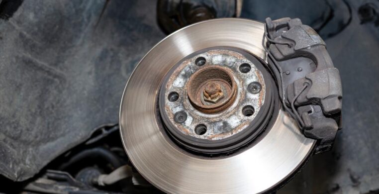 Close-up image of new brake pads and discs during replacement at a Nottingham garage, showing high-quality automotive parts for optimal safety.